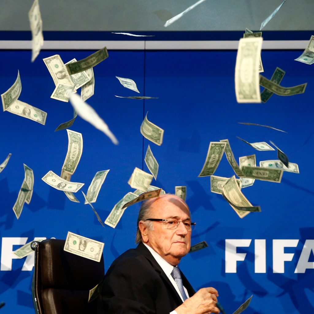 a protester threw a stack of fake money at fifa president sepp blatter during a press conference